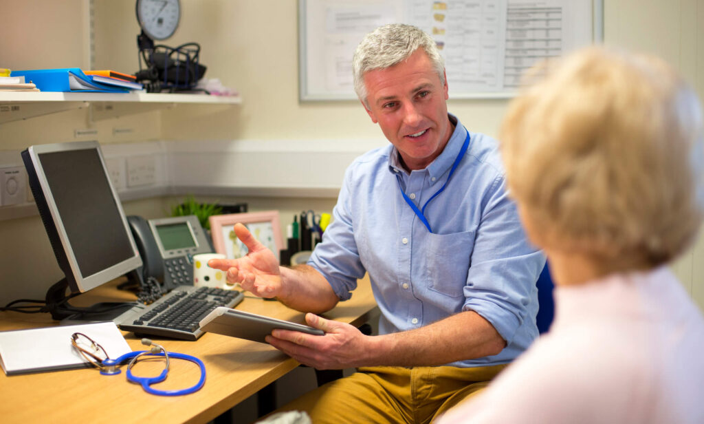 Private GP Consultations in Eastbourne and Hastings modelled here showing GP with patient